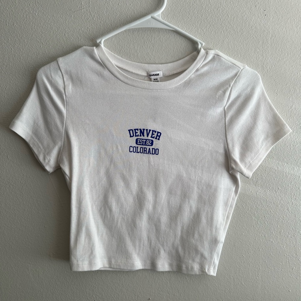 Garage Stormi Tee | White Denver Colorado |
Baby tee